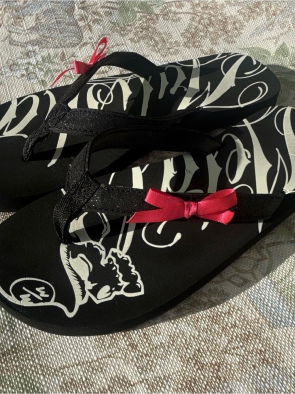 Metal Mulisha Black and Pink Bow Flip Flop Sandals